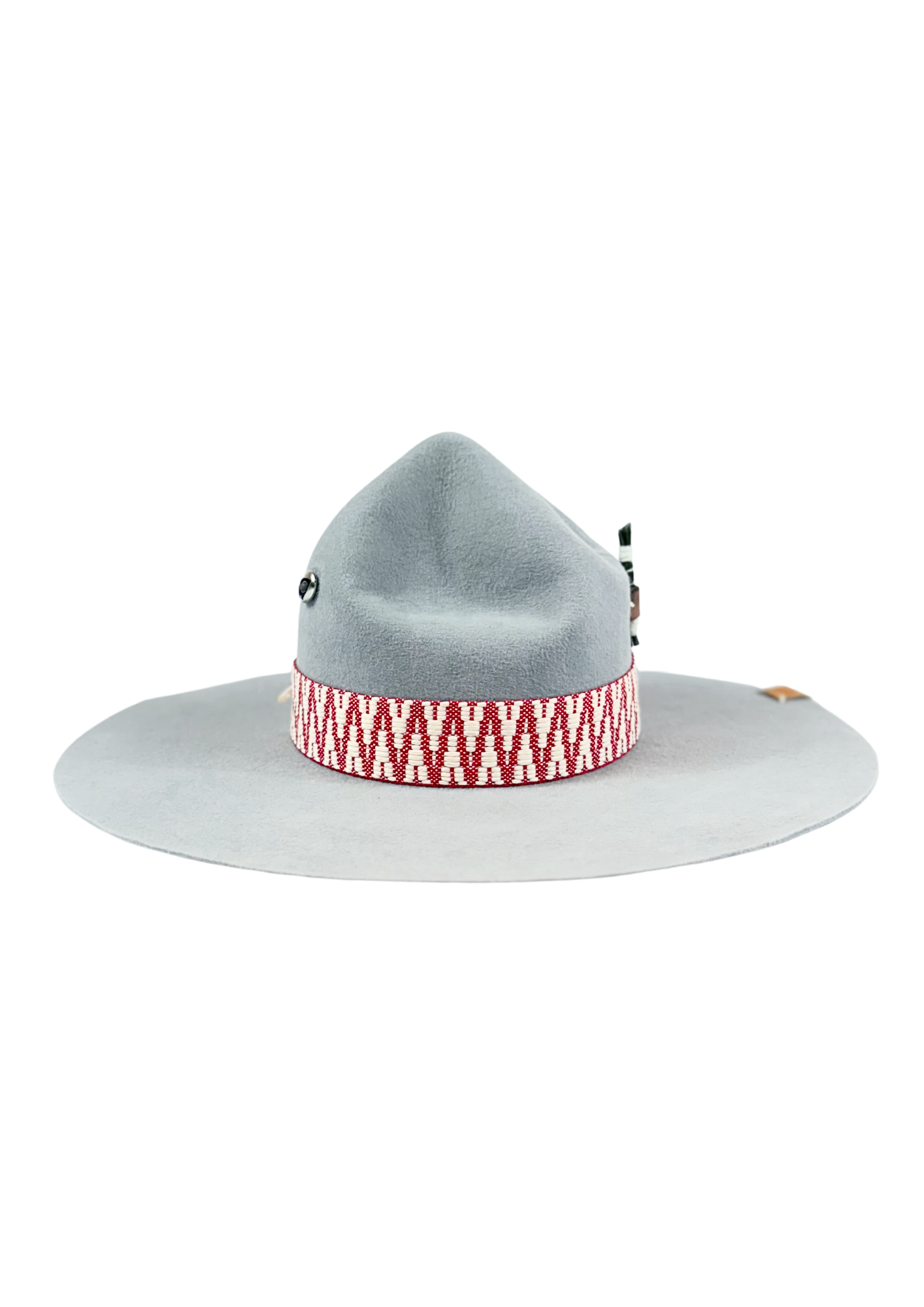 Gray wide-brimmed hat with a red and white patterned band on a white background with feather and pine element